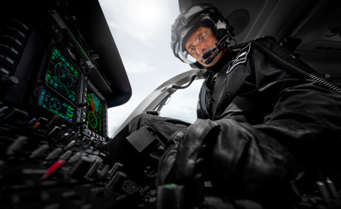 Pilot Matt Wilcock in cockpit of Wiltshire Air Ambulance's helicopter