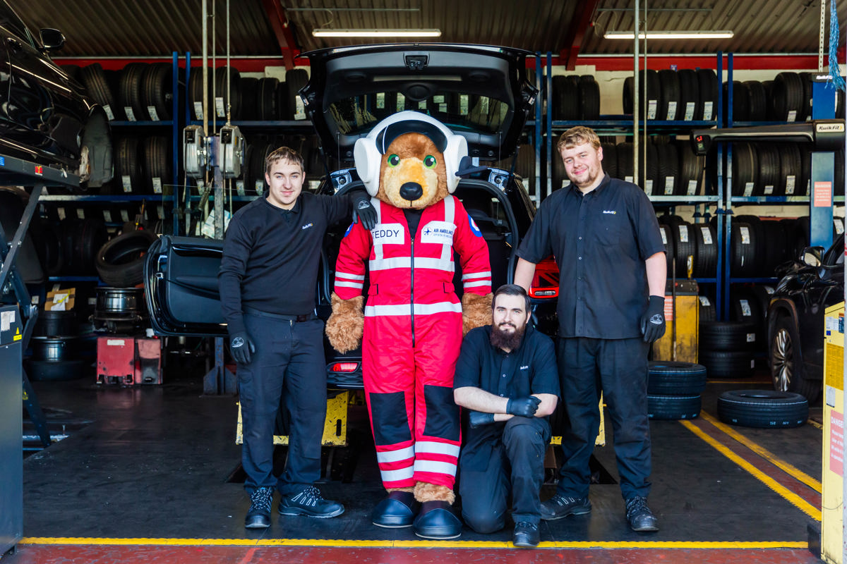 Teddy The Air Ambulances UK Mascot Joined The Kwik Fit Borehamwood Team To Mark The New Charity Partnership on Kwik Fit and Air Ambulances UK announce new national partnership