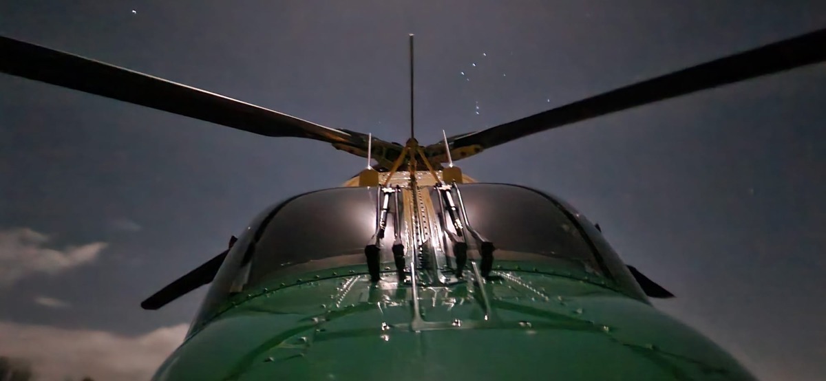 Front view of the WAA helicopter at night with stars in the background