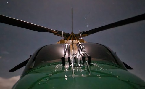 Front view of the WAA helicopter at night with stars in the background