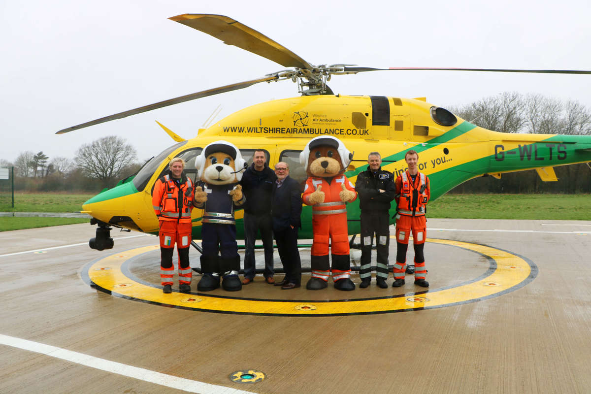 Mascot sponsor Soft Options photographed alongside two paramedics, a pilot and our two charity bear mascots Wilber and Marsha.