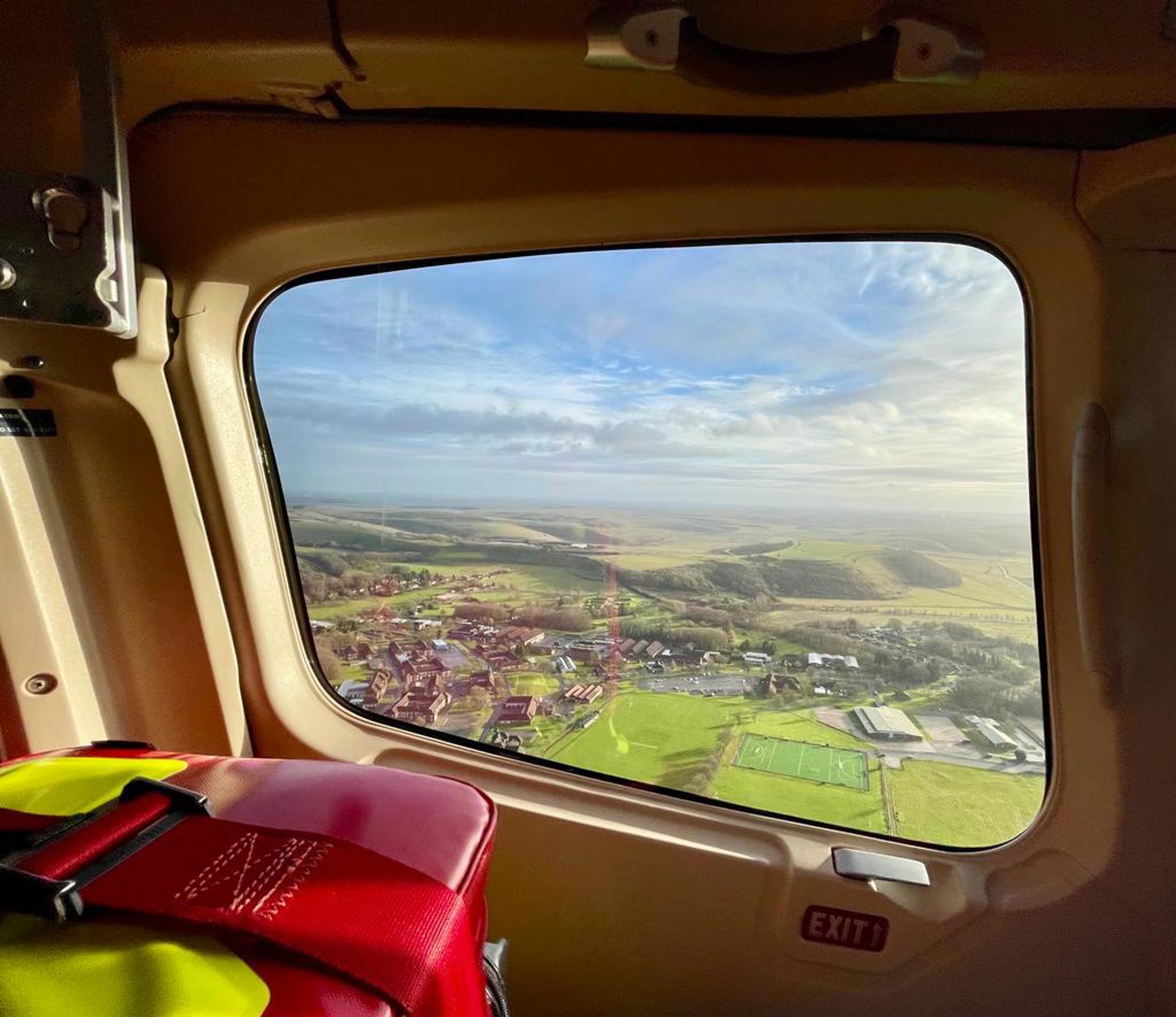 A view of Warminster out of a window of Wiltshire Air Ambulance's helicopter