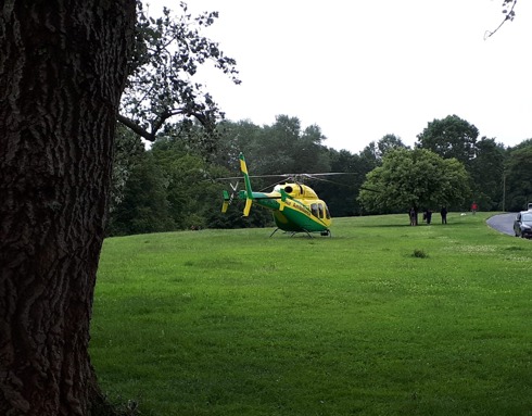 Wiltshire Air Ambulance's helicopter landed by the side of a road in Chippenham