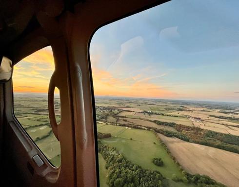 A view of a sunset from the helicopter