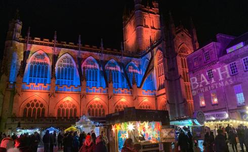 The exterior of Bath Abbey lit up with Christmas lights
