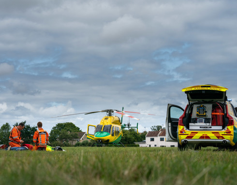 A staged incident in a field with the helicopter and critical care car