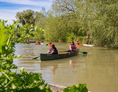 Children from Youth Action Wiltshire taking part in a canoeing trip