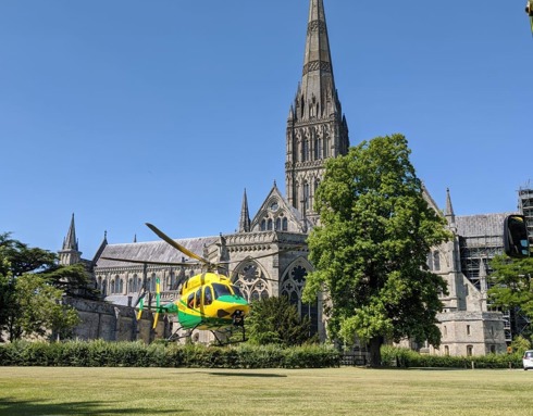 Wiltshire Air Ambulance taking off from Salisbury Cathedral