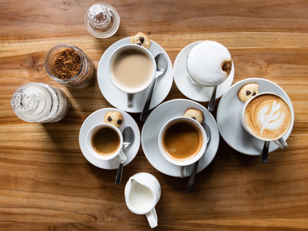 Various coffees on a wooden table