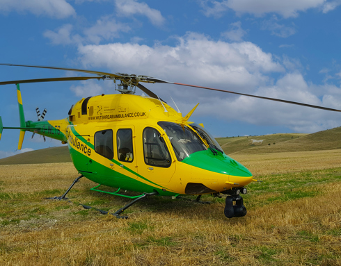 Wiltshire Air Ambulance's helicopter with Pewsey's white horse in the background
