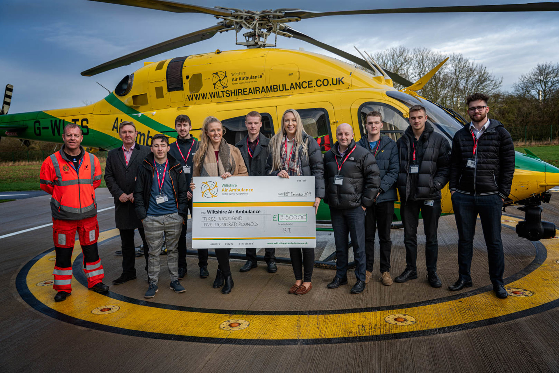 Staff from BT at a cheque presentation at WAA's airbase