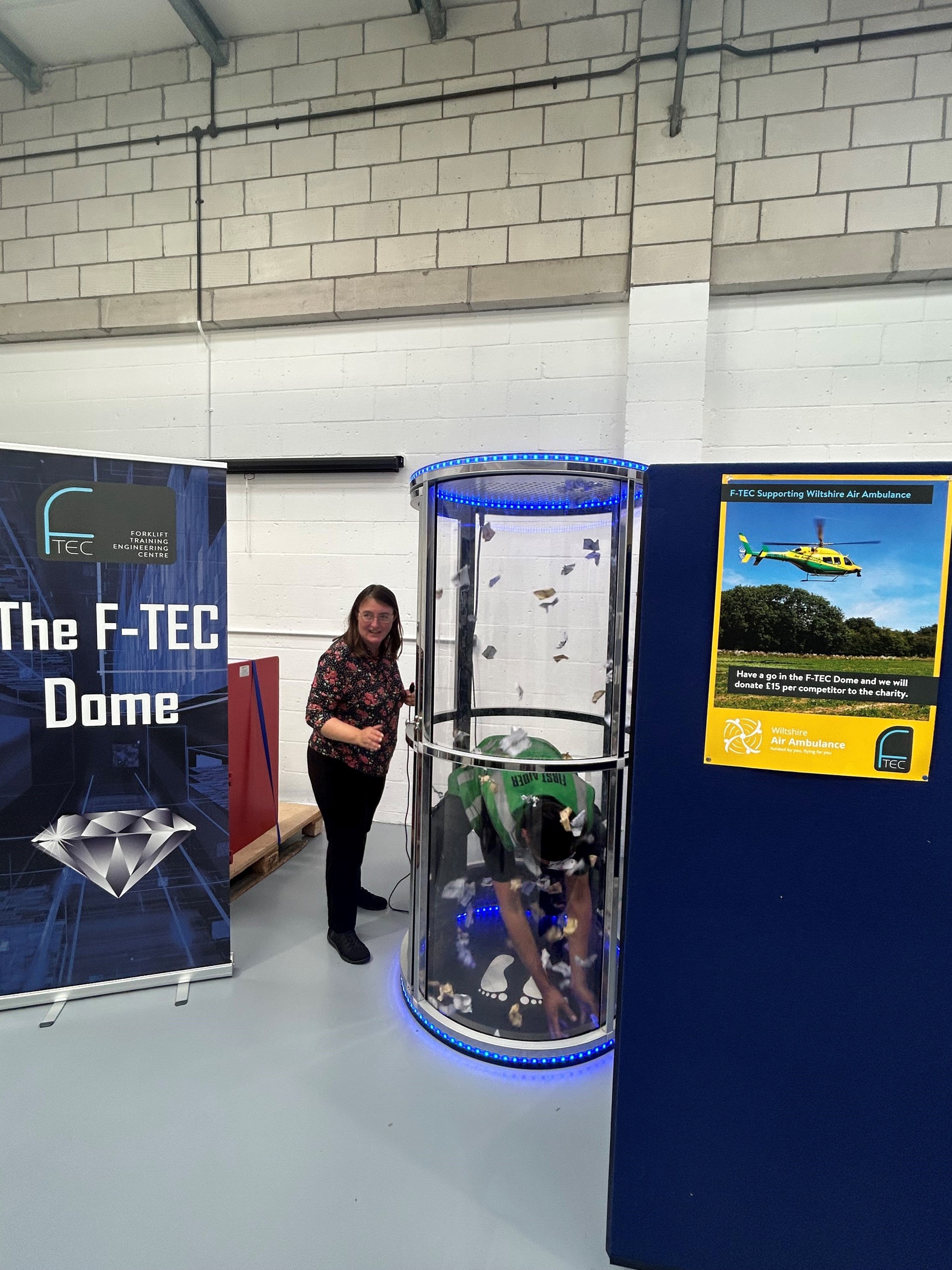 A fundraising activity involving an air dome where participants collect fake cash