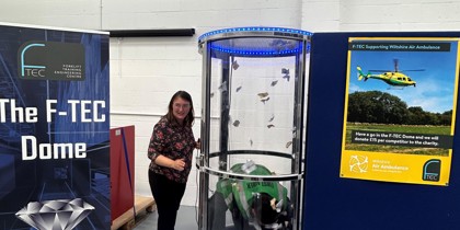 A fundraising activity involving an air dome where participants collect fake cash