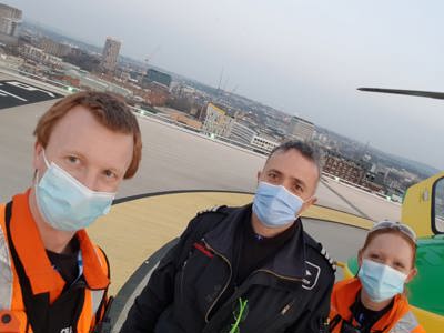 Paramedics Craig and Sophie and Pilot Matt wearing face masks on BRI helipad
