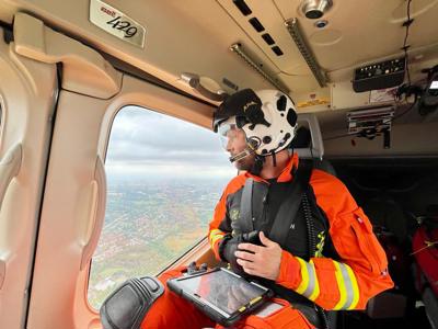 Critical care paramedic Ben Abbott admiring the view from the Wiltshire Air Ambulance helicopter.